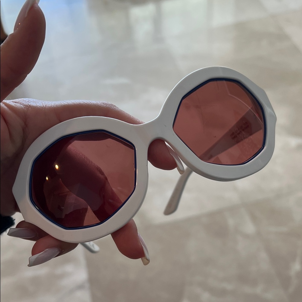 White Sunglasses with Pink Lenses
Marni.